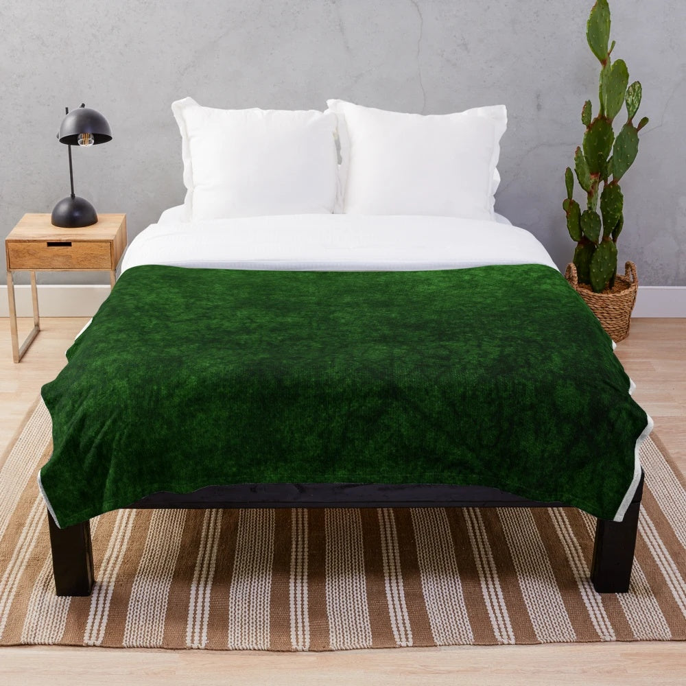 Emerald green velvet plush blanket with a soft, textured design