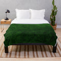 Emerald green velvet plush blanket with a soft, textured design
