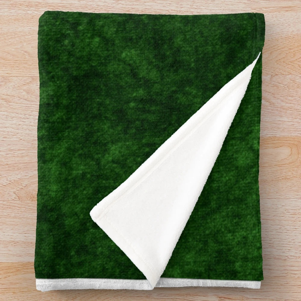Emerald green velvet plush blanket with a soft, textured design