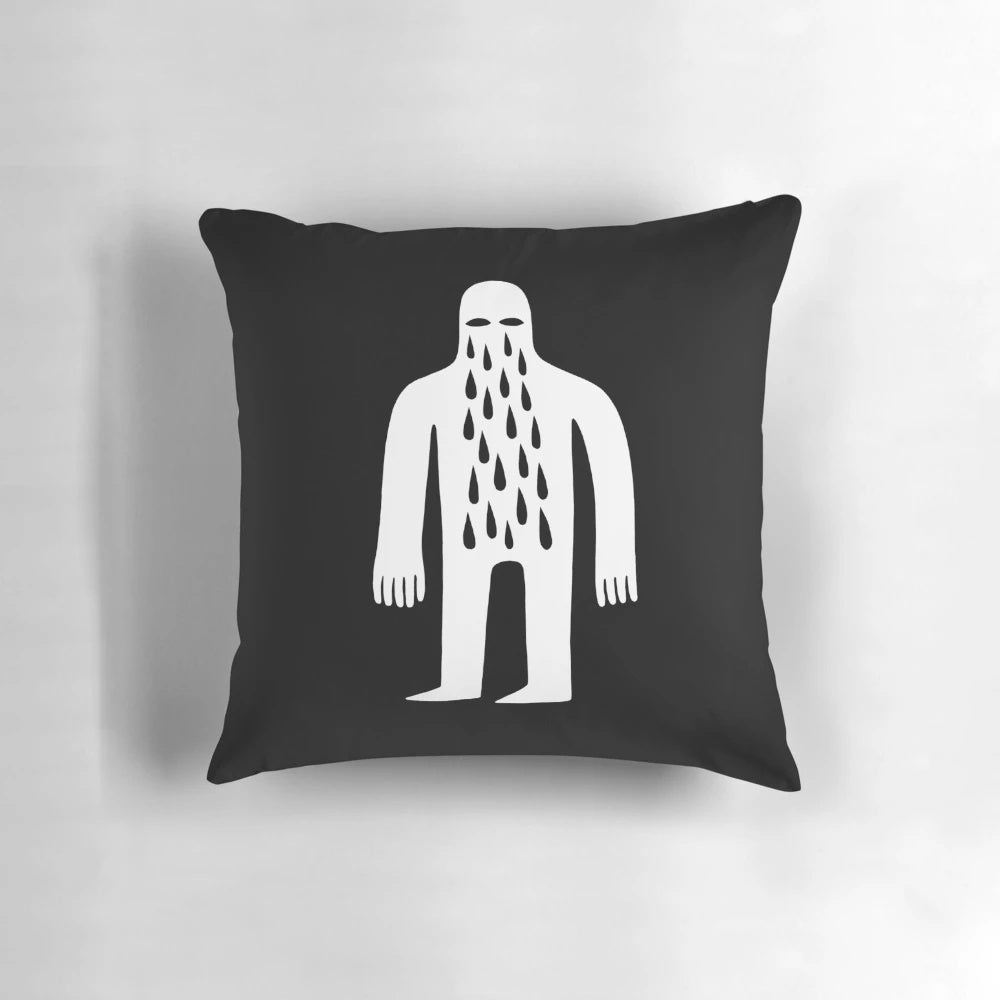 Monochromatic pillow featuring a simple, crying male figure in a minimalist, street art-inspired design.