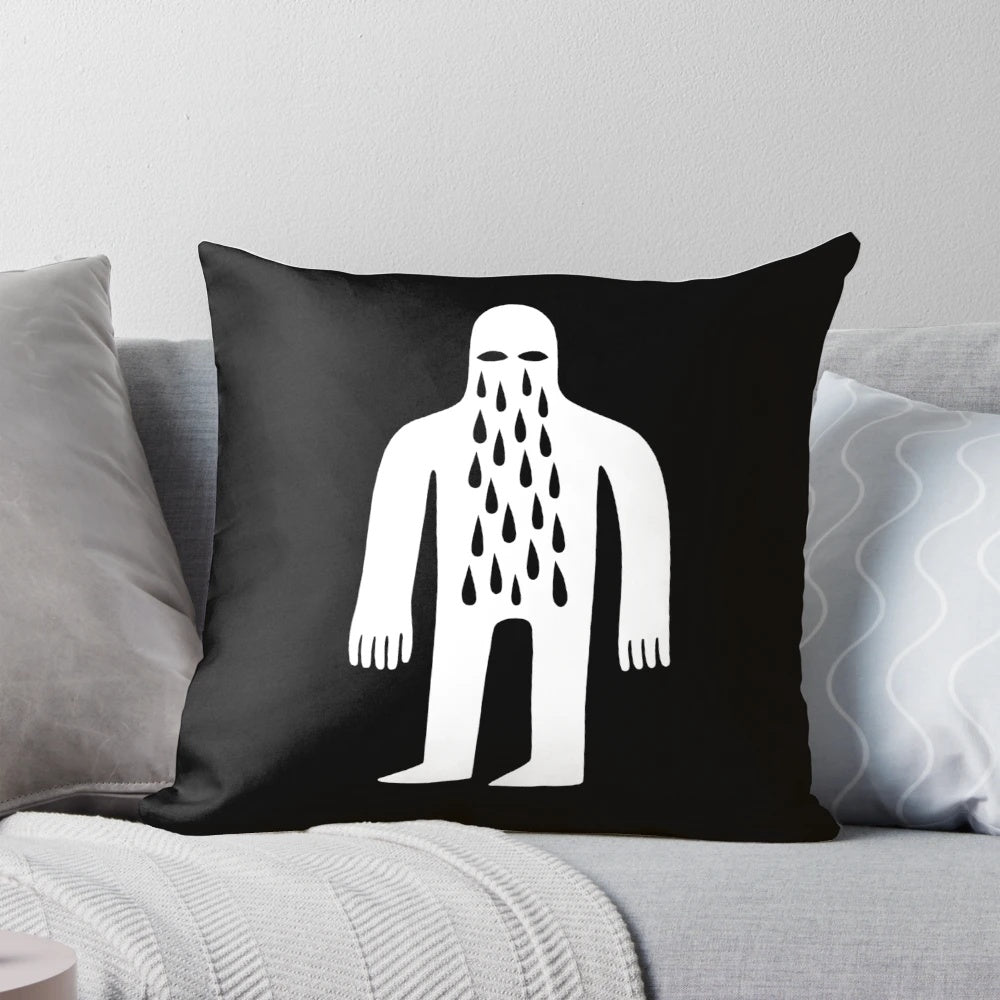 Monochromatic pillow featuring a simple, crying male figure in a minimalist, street art-inspired design.