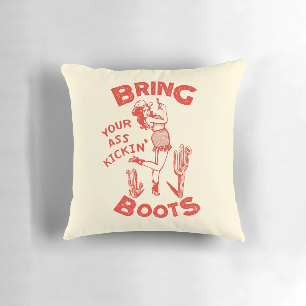Decorative throw pillow featuring a retro-style illustration of a confident, gun-toting cowgirl