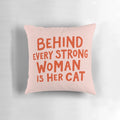 Pillow with text "Behind Every Strong Woman" and cats