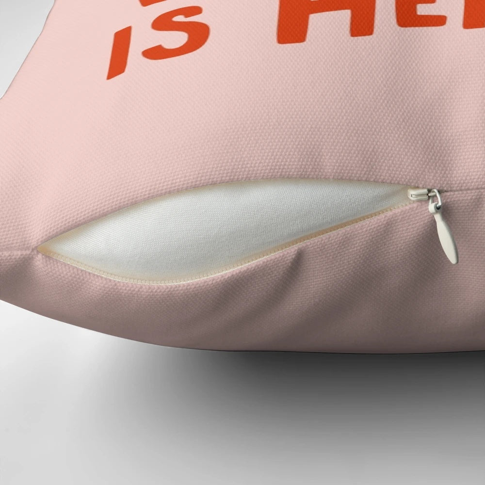 Pillow with text "Behind Every Strong Woman" and cats