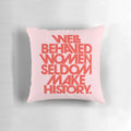 Decorative pink and red throw pillow with the quote "Well Behaved Women Seldom Make History"