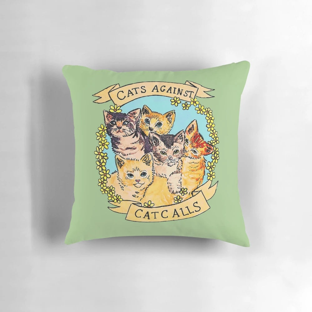 Colorful decorative throw pillow featuring cats against catcalls design, promoting feminism and women's rights.