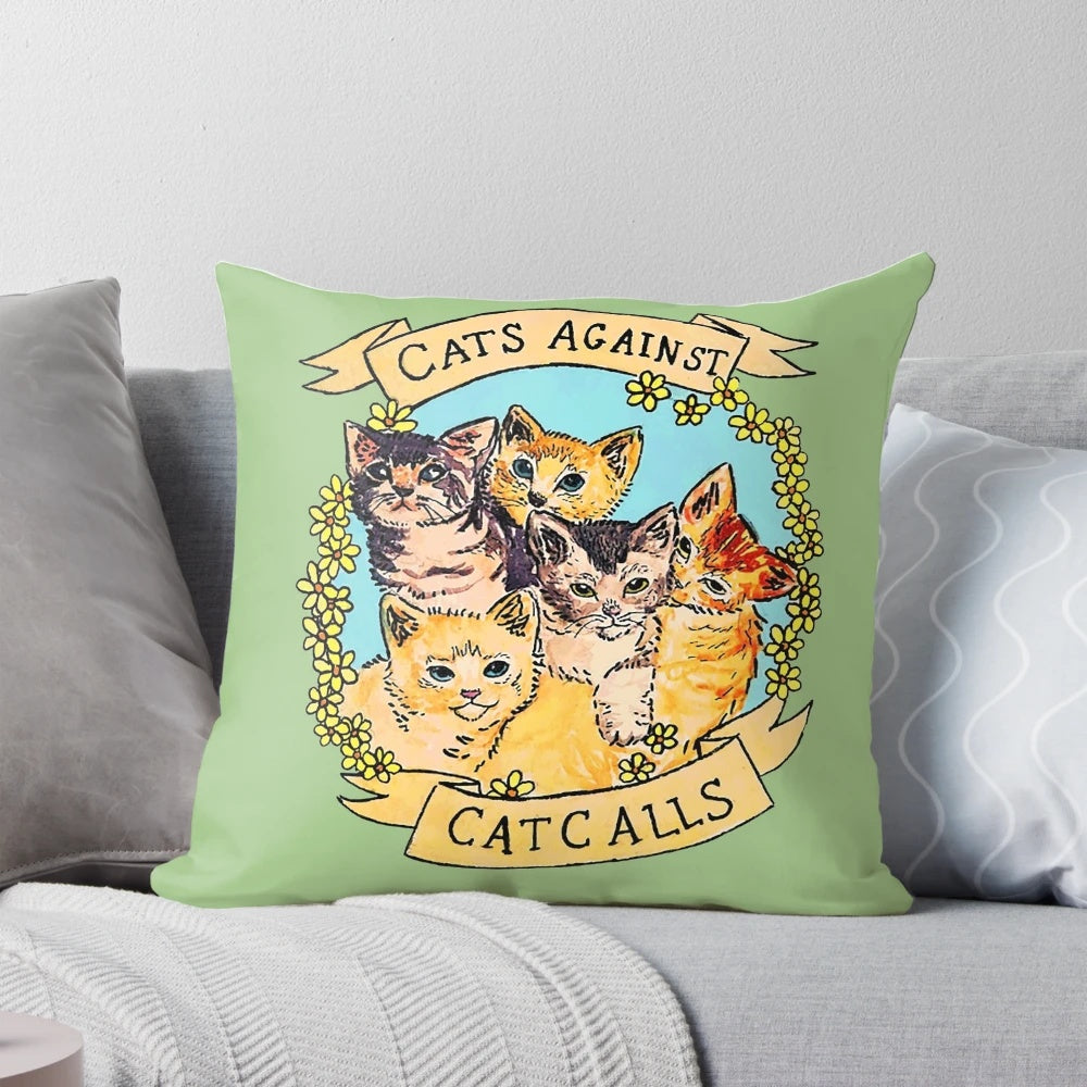 Colorful decorative throw pillow featuring cats against catcalls design, promoting feminism and women's rights.
