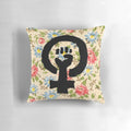 Floral throw pillow with a raised fist, symbolizing feminist empowerment and social progress.