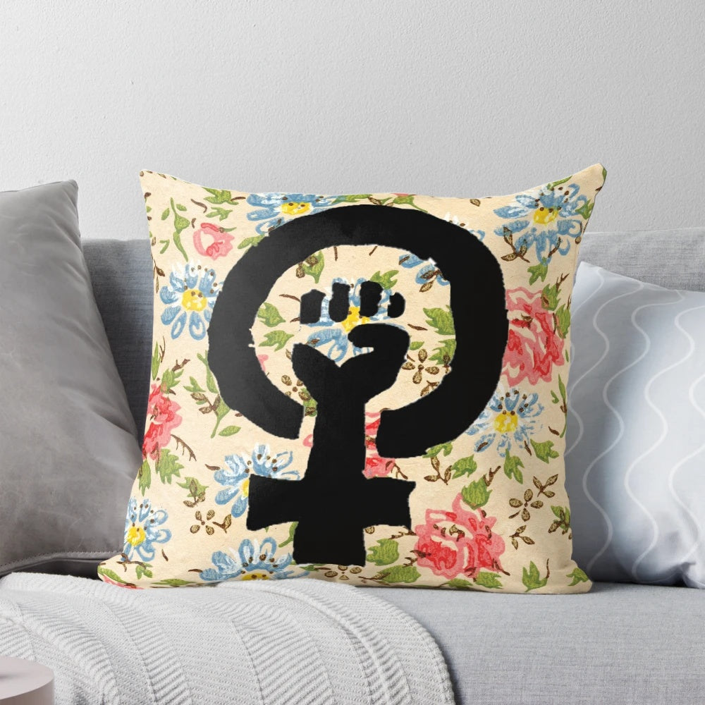 Floral throw pillow with a raised fist, symbolizing feminist empowerment and social progress.
