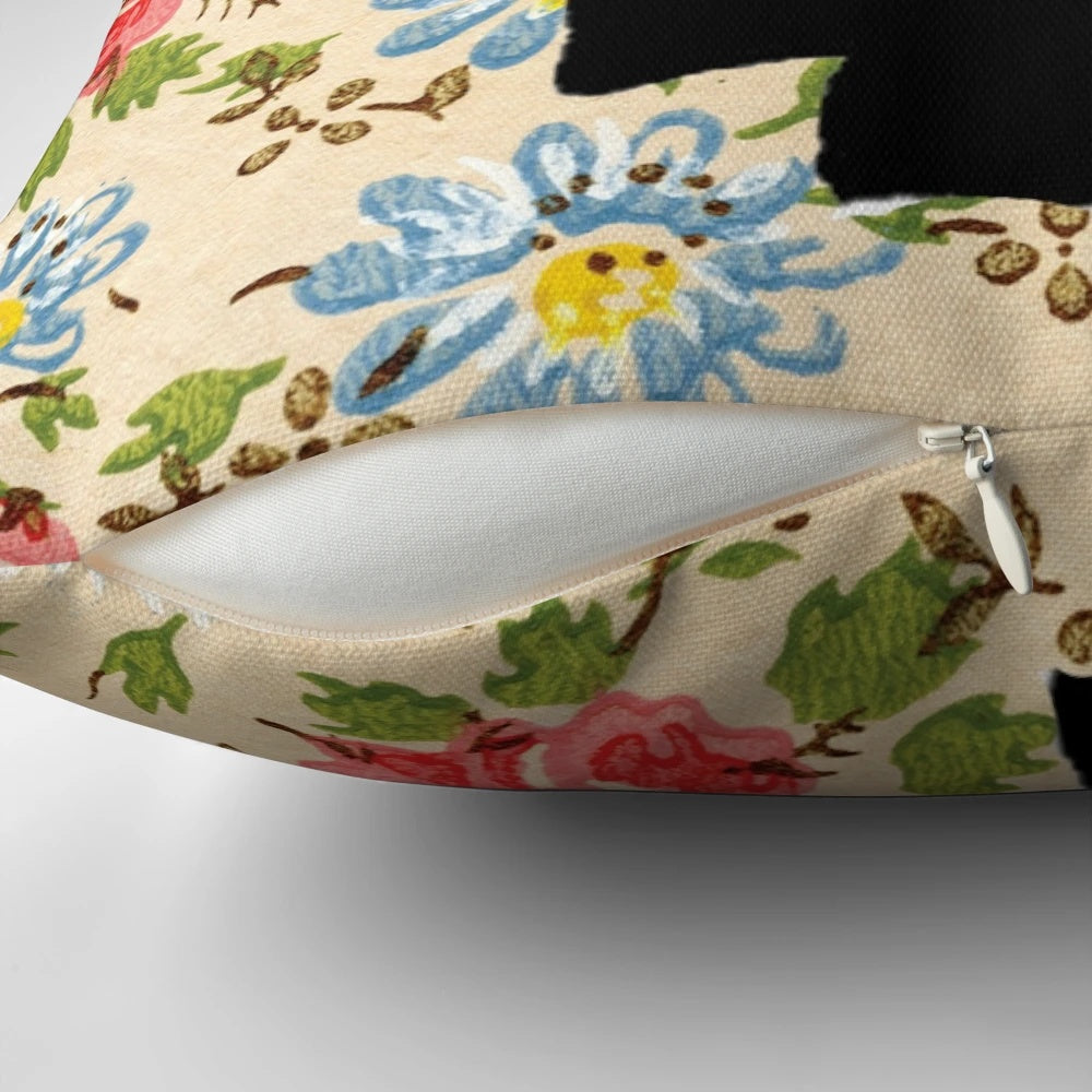 Floral throw pillow with a raised fist, symbolizing feminist empowerment and social progress.