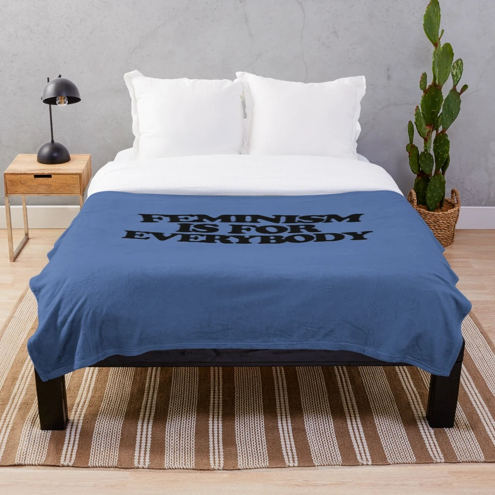 Soft and cozy plush blanket featuring a feminist design