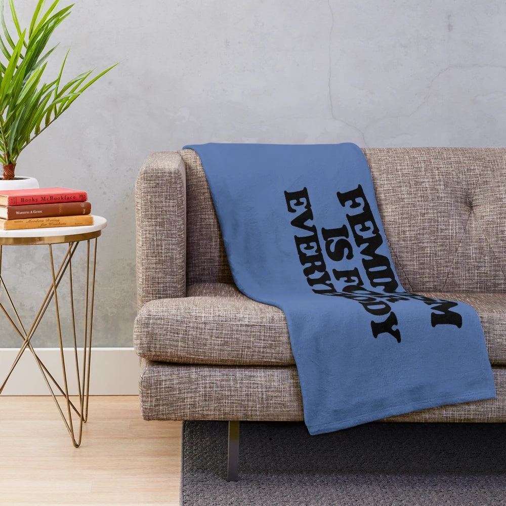 Soft and cozy plush blanket featuring a feminist design