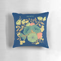 A beautiful blue and white pillow with a floral design and the words "nevertheless she persisted" - an inspirational home decor item for female empowerment.