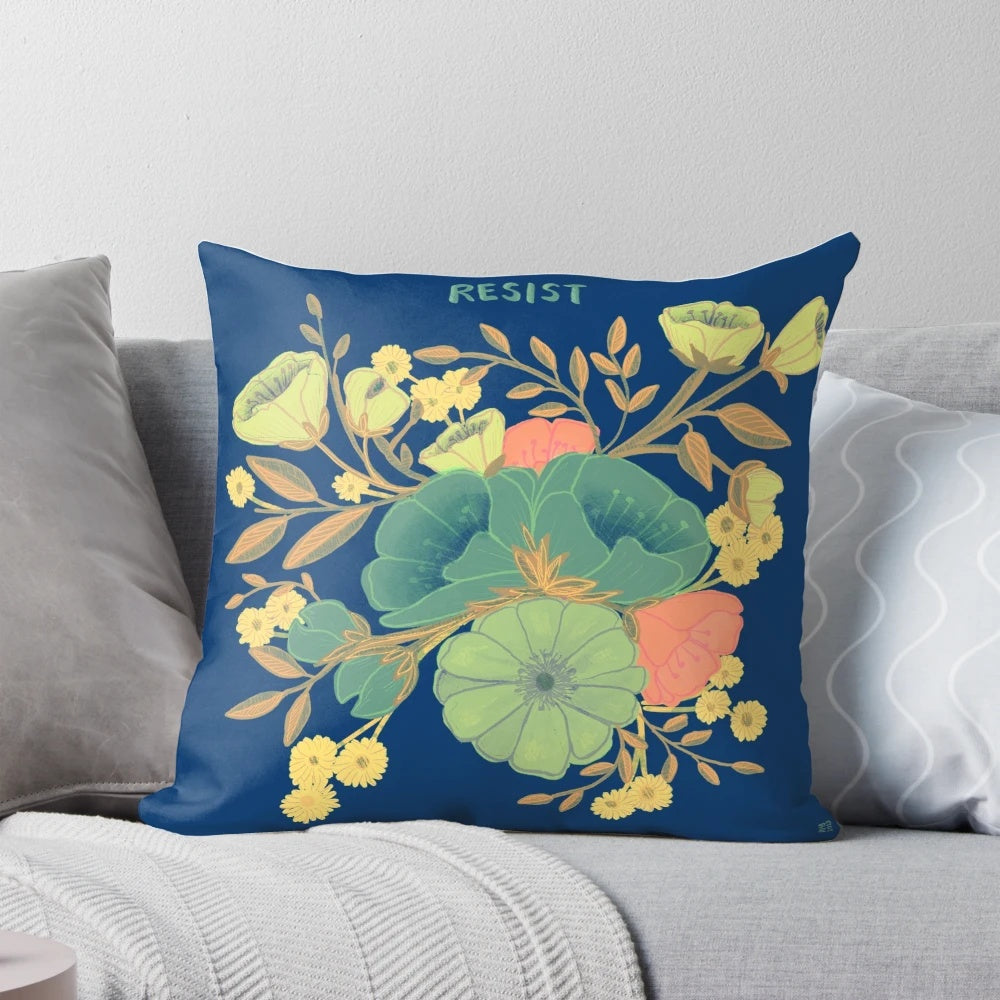 A beautiful blue and white pillow with a floral design and the words "nevertheless she persisted" - an inspirational home decor item for female empowerment.