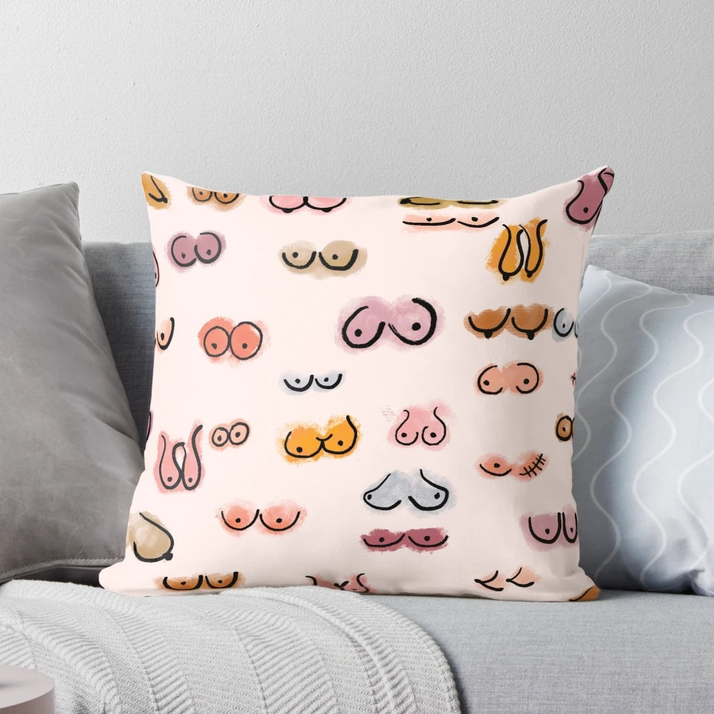 A decorative watercolor throw pillow featuring a whimsical boobs design in soft pastel tones.