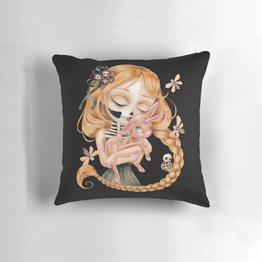 An enchanting pillow design featuring a surreal, gothic-inspired image of a girl with big eyes, unicorns, and skulls.