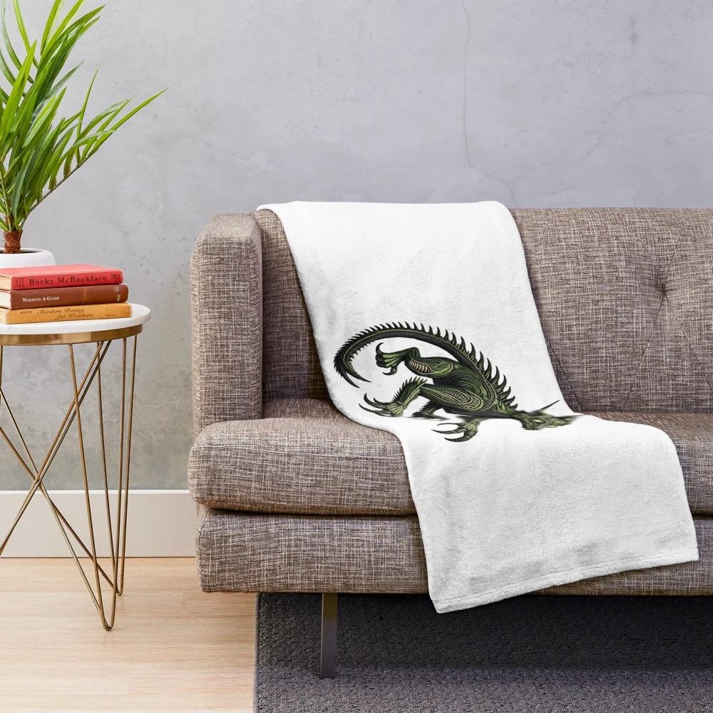Embroidered chupacabra plush blanket featuring a legendary cryptid