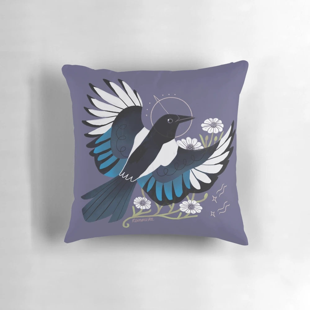 Whimsical throw pillow featuring a vibrant illustration of a European magpie bird surrounded by purple flowers and stars