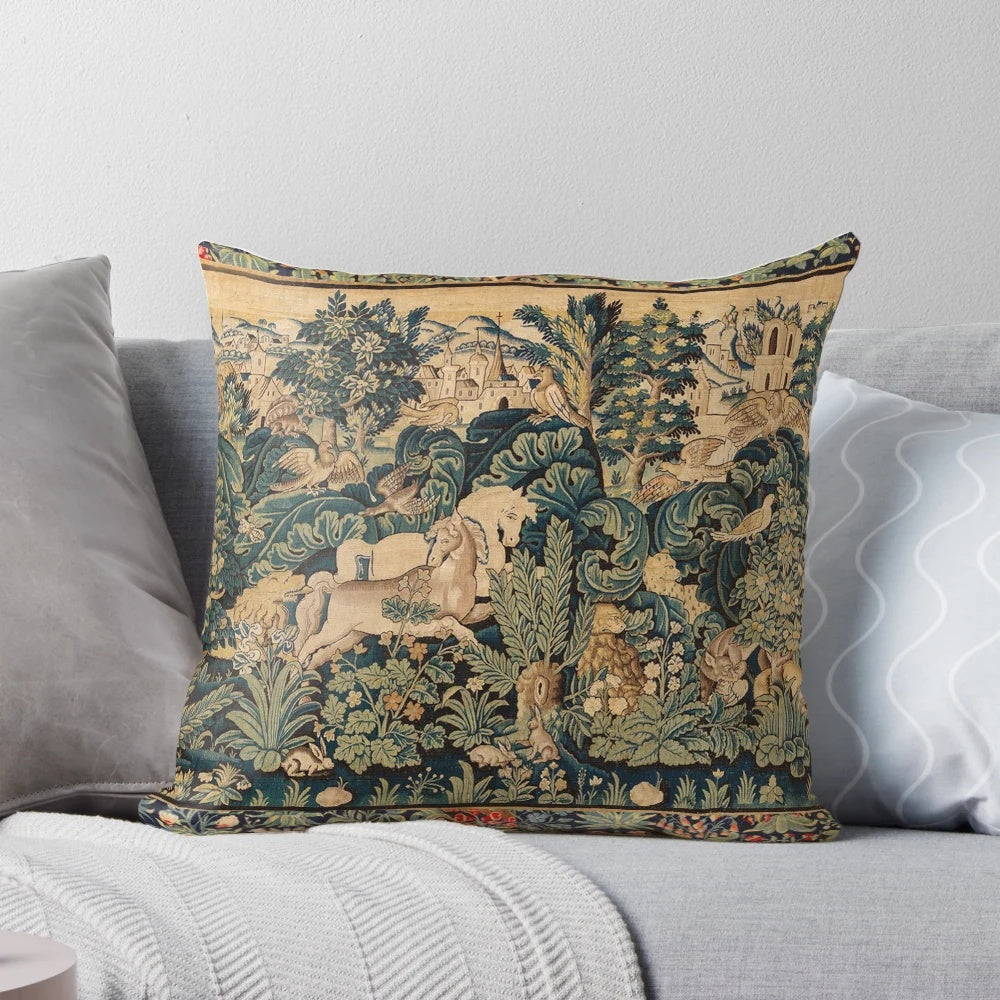 Decorative pillow featuring a tapestry-style design with fantasy animals and white horses in a woodland setting.