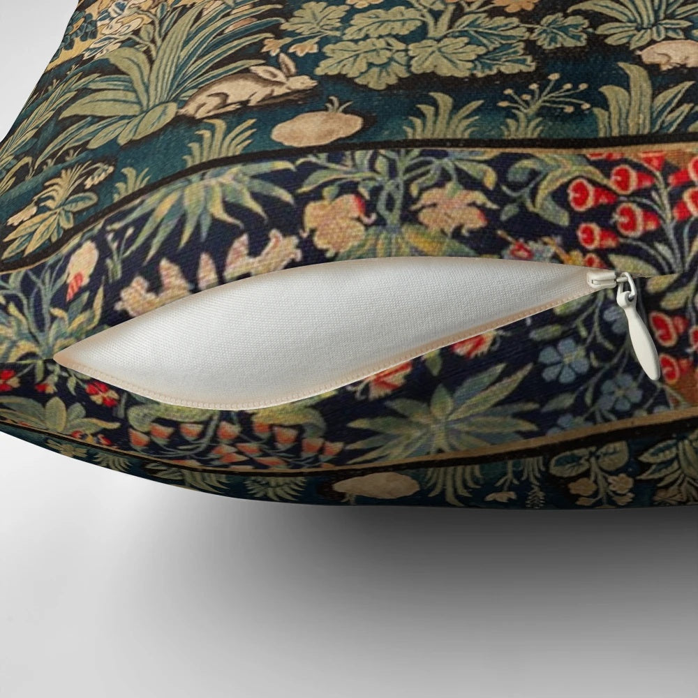 Decorative pillow featuring a tapestry-style design with fantasy animals and white horses in a woodland setting.