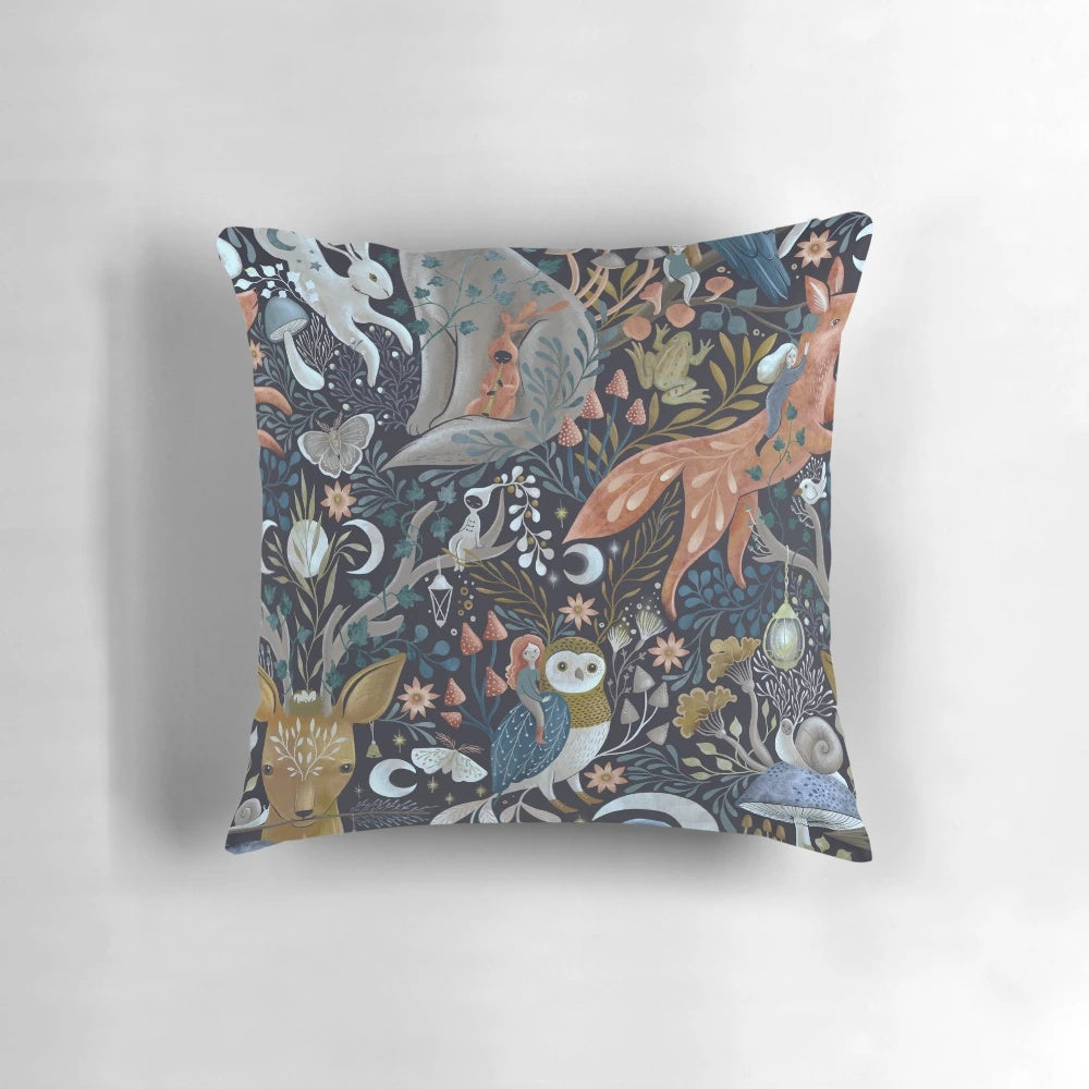 A whimsical gothic pattern pillow featuring owls, foxes, wolves, deer, crows, and mushrooms in a dark, enchanted forest setting