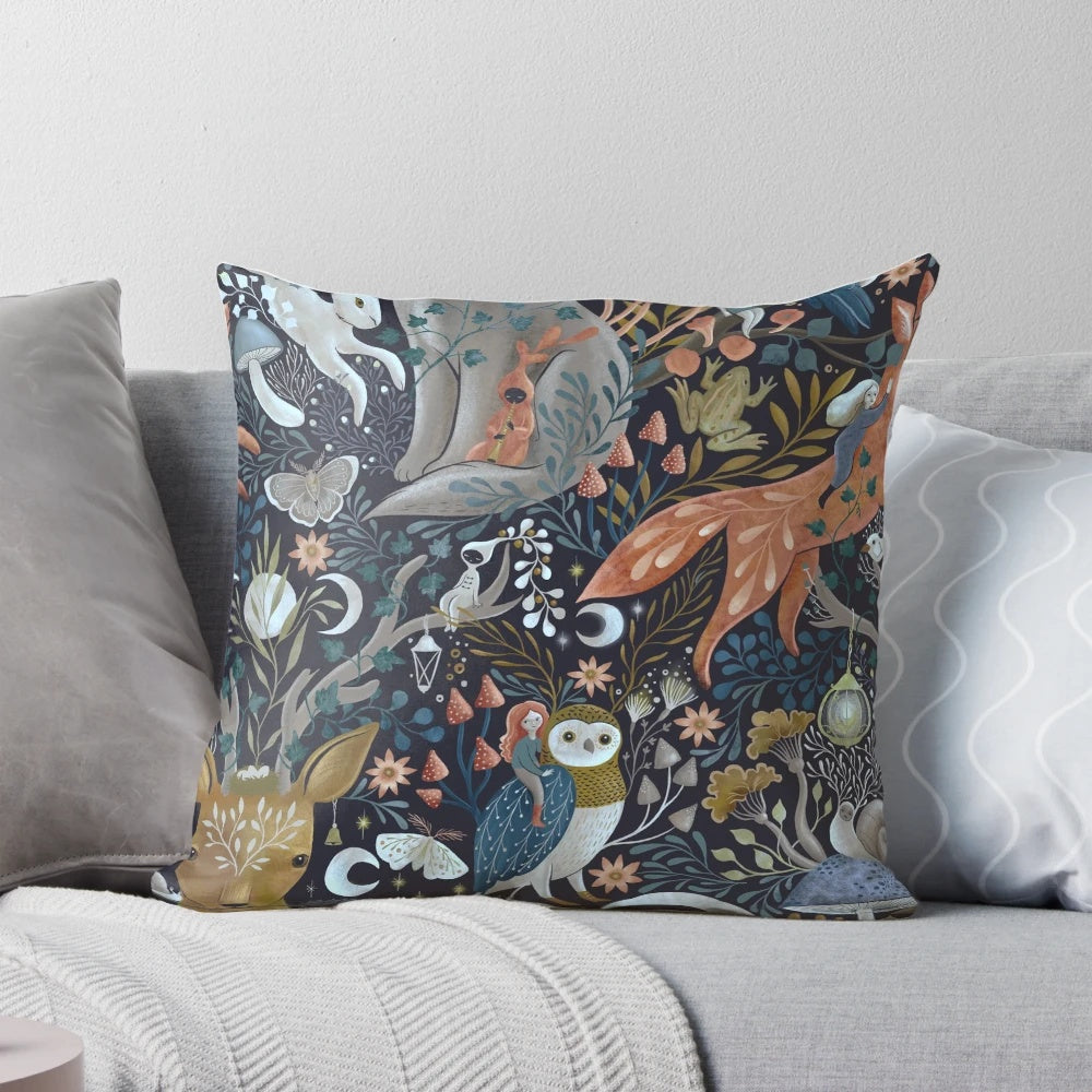 A whimsical gothic pattern pillow featuring owls, foxes, wolves, deer, crows, and mushrooms in a dark, enchanted forest setting