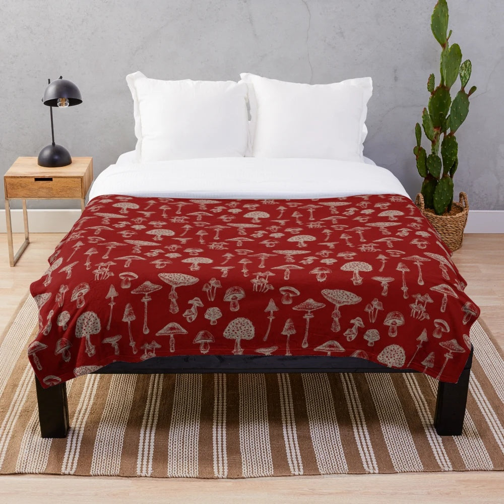 Soft and cozy plush blanket with whimsical forest and mushroom design