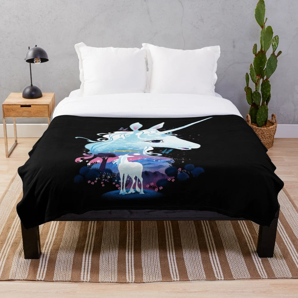 Soft and cozy plush blanket with a magical forest and unicorn design