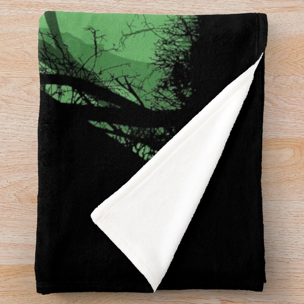 Plush blanket with fantasy landscape and sword design