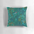 Decorative throw pillow featuring an illustration of emerald green forest animals, flowers, and mushrooms on a nature-inspired pattern.