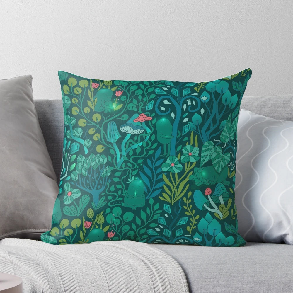 Decorative throw pillow featuring an illustration of emerald green forest animals, flowers, and mushrooms on a nature-inspired pattern.