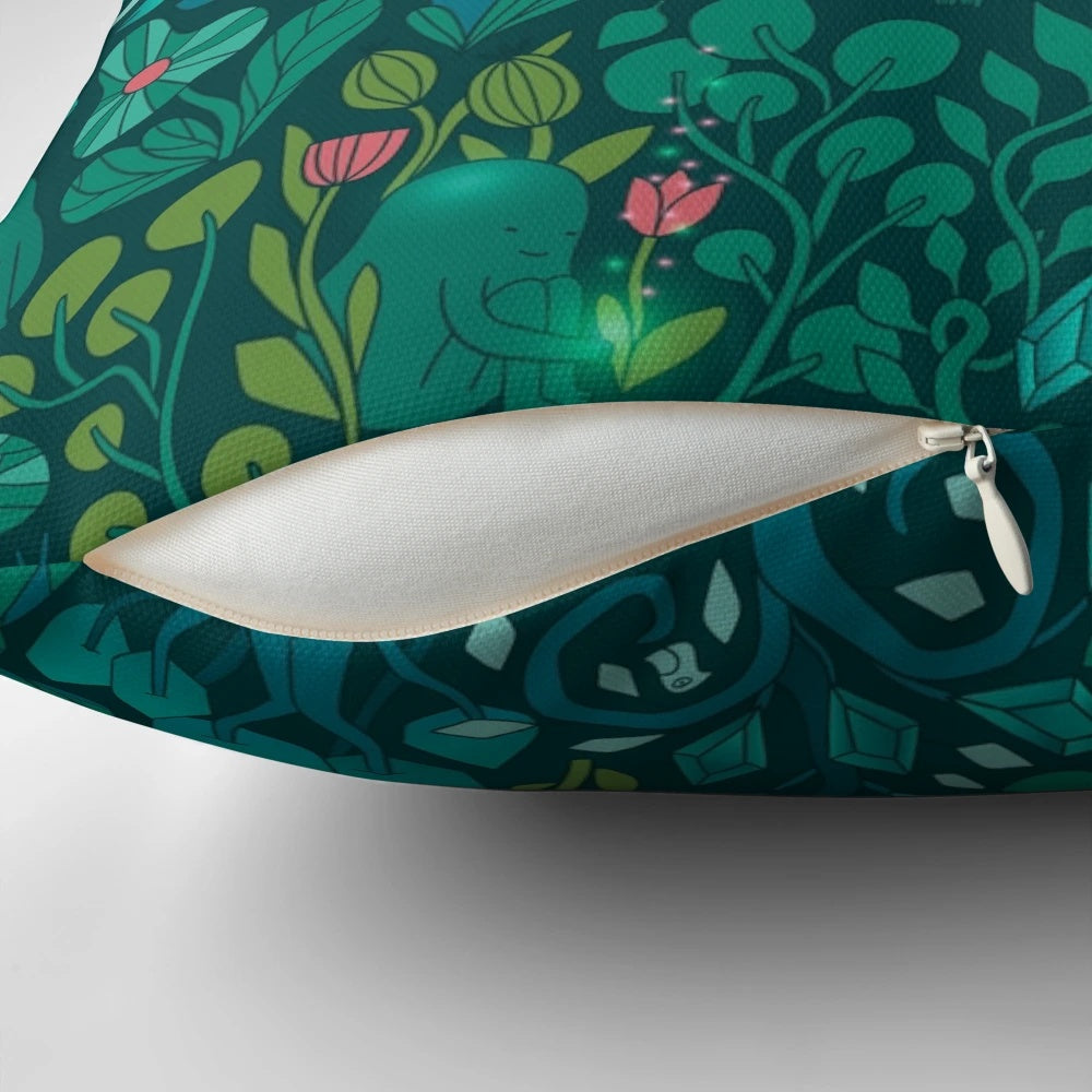 Decorative throw pillow featuring an illustration of emerald green forest animals, flowers, and mushrooms on a nature-inspired pattern.
