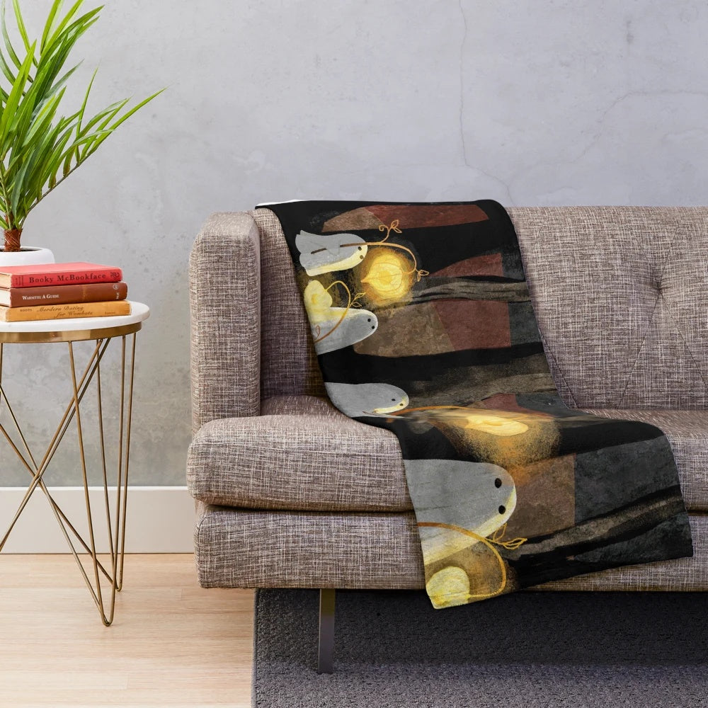 Haunted forest plush blanket with glowing lanterns and eerie moon