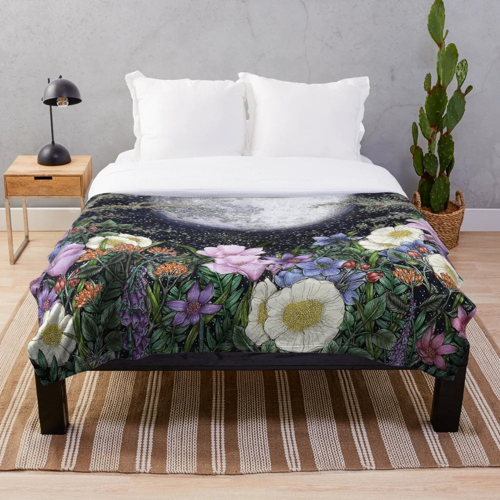 Plush blanket featuring a pen and ink illustration of a magical midnight garden scene with a glowing moon, flowers, and trees