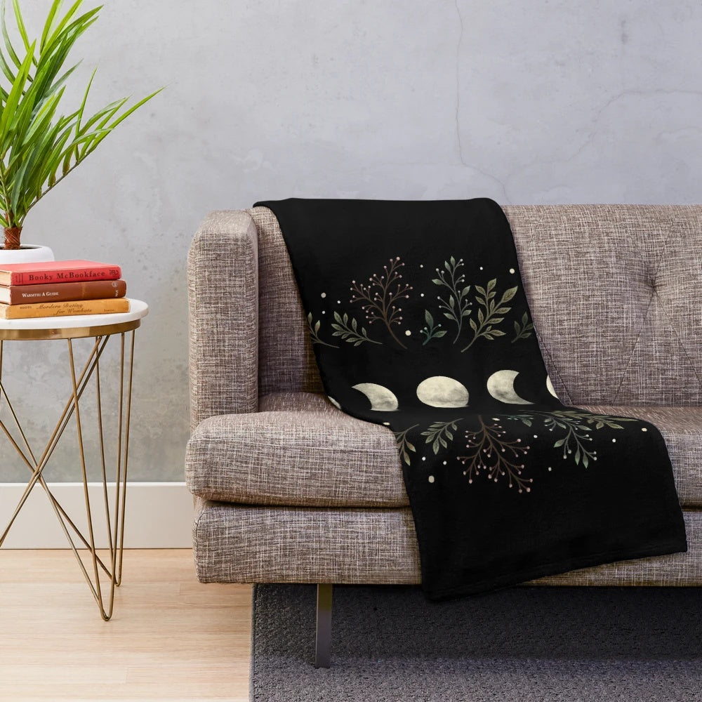 Olive green plush blanket with a botanical moonlit garden design