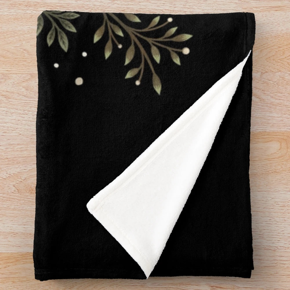 Olive green plush blanket with a botanical moonlit garden design