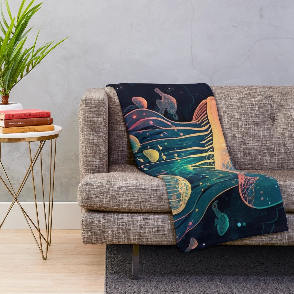Plush blanket featuring a variety of mythical sea creatures and fantasy animals