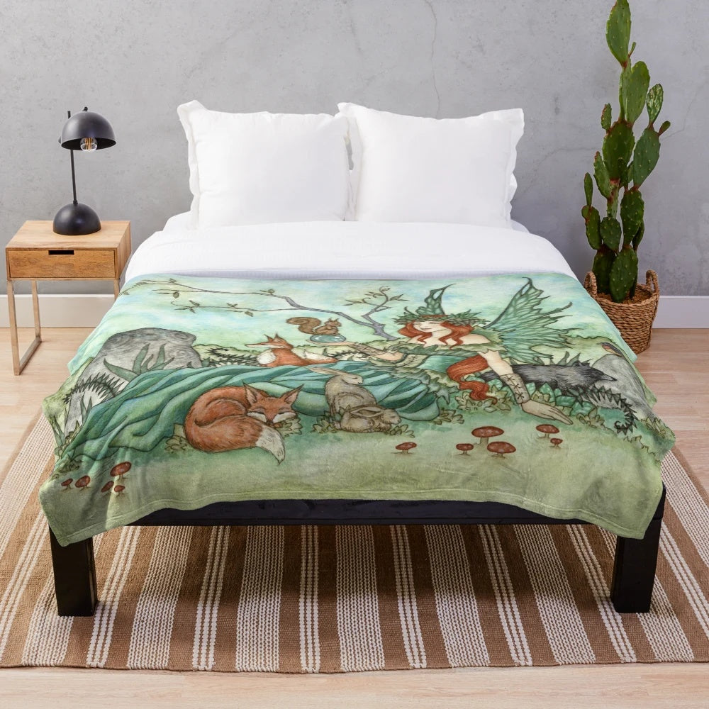Plush blanket featuring whimsical woodland creatures in a fairy fantasy design