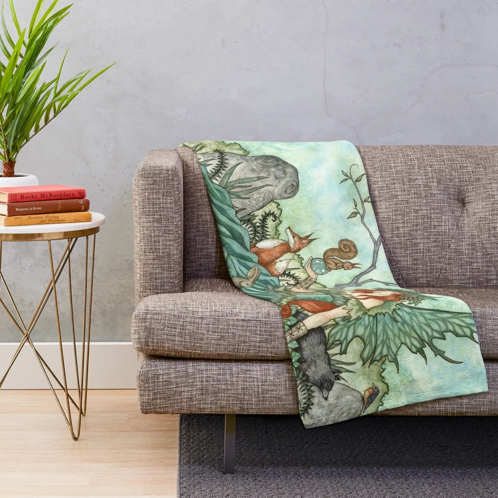 Plush blanket featuring whimsical woodland creatures in a fairy fantasy design