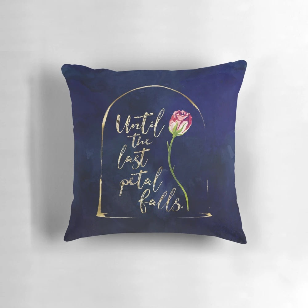 Decorative throw pillow featuring an enchanted rose illustration and quote from the Beauty and the Beast fairy tale.