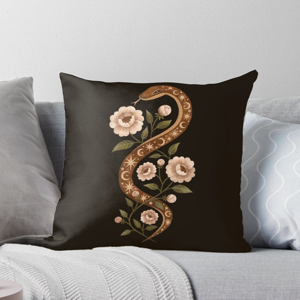 A decorative pillow featuring a serpent or snake design in a mystical, enchanted floral scene with stars and moon.