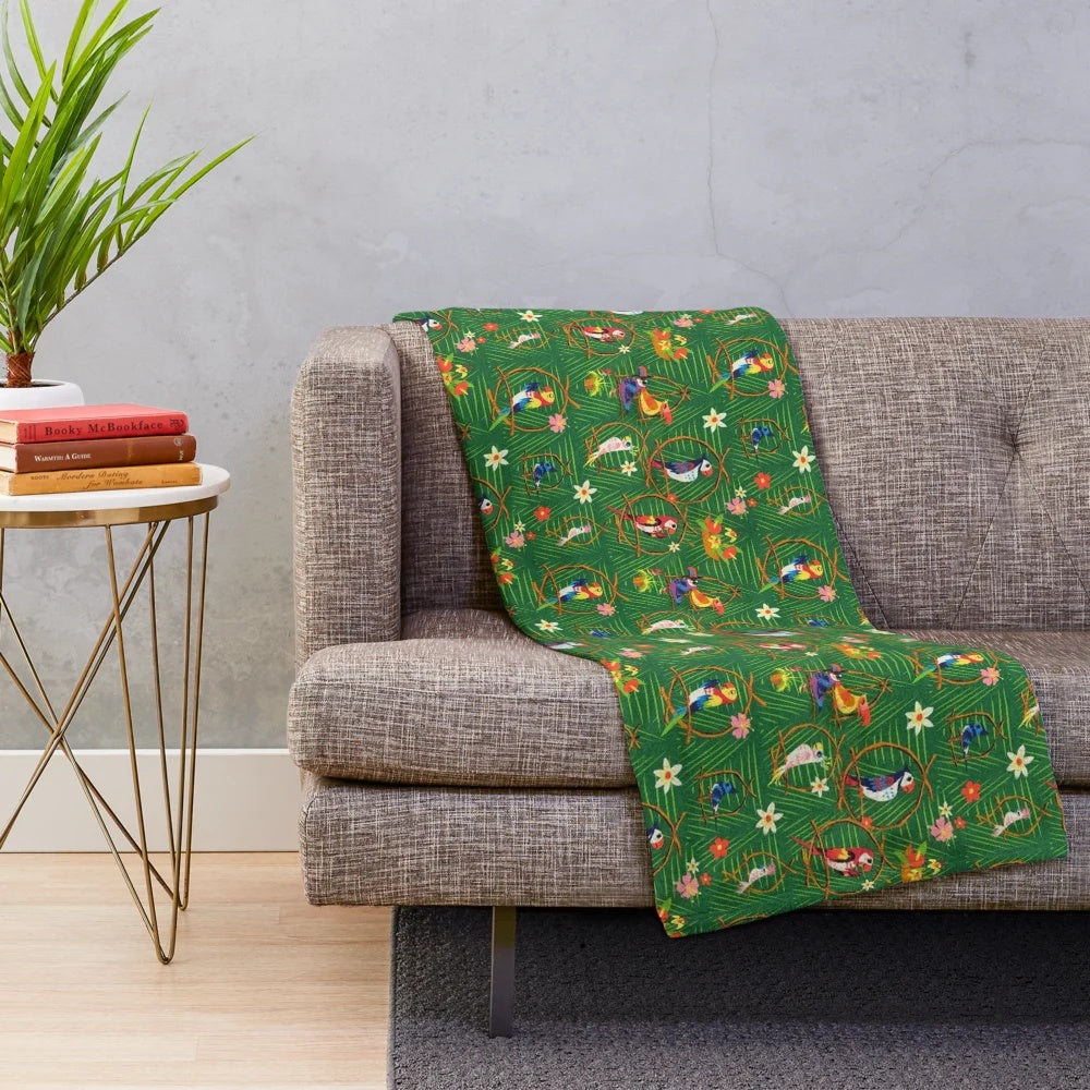 Enchanted tiki-inspired plush blanket with tropical birds and rainbow colors