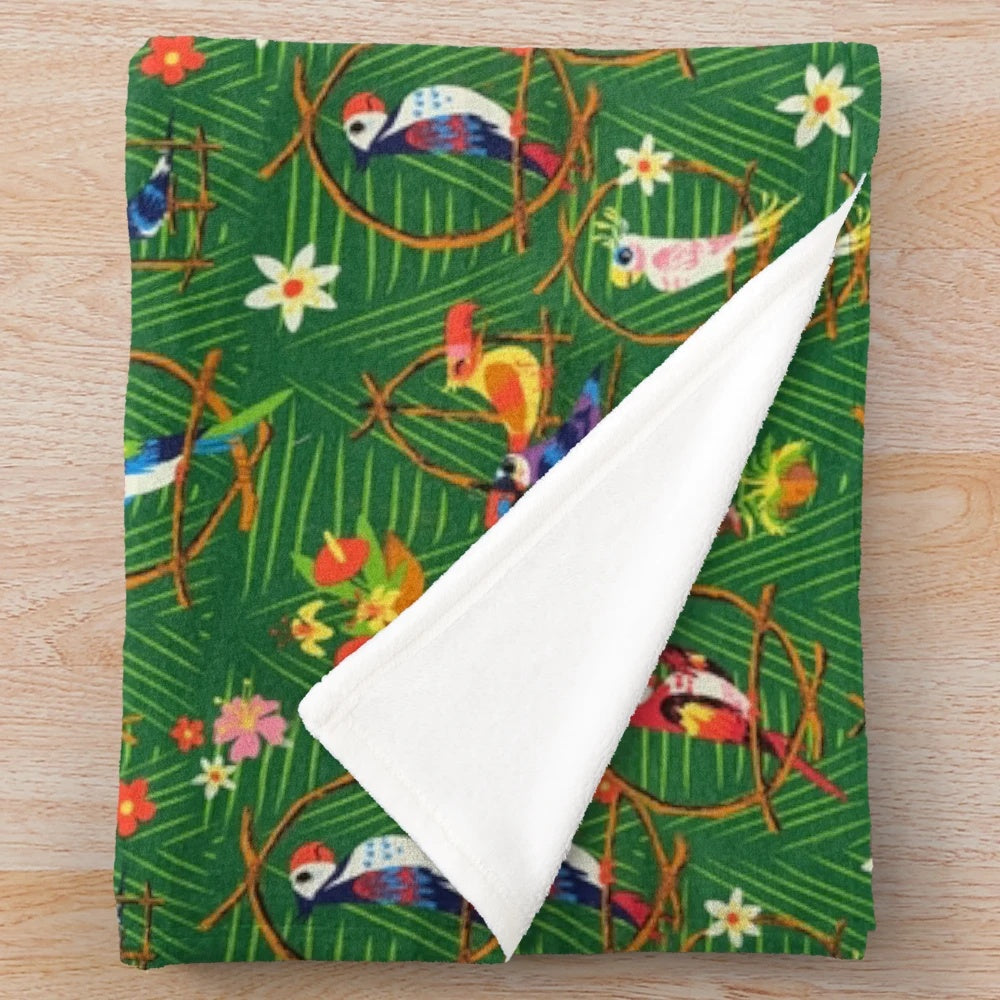 Enchanted tiki-inspired plush blanket with tropical birds and rainbow colors