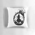 Silhouette of the Cheshire Cat from Alice in Wonderland on a decorative throw pillow