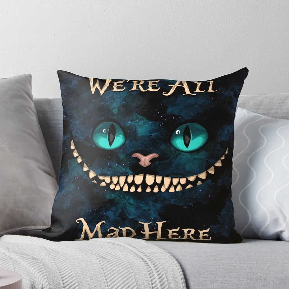 Whimsical Alice in Wonderland-themed pillow with illustrations of the Cheshire Cat, Mad Hatter, and other iconic characters.