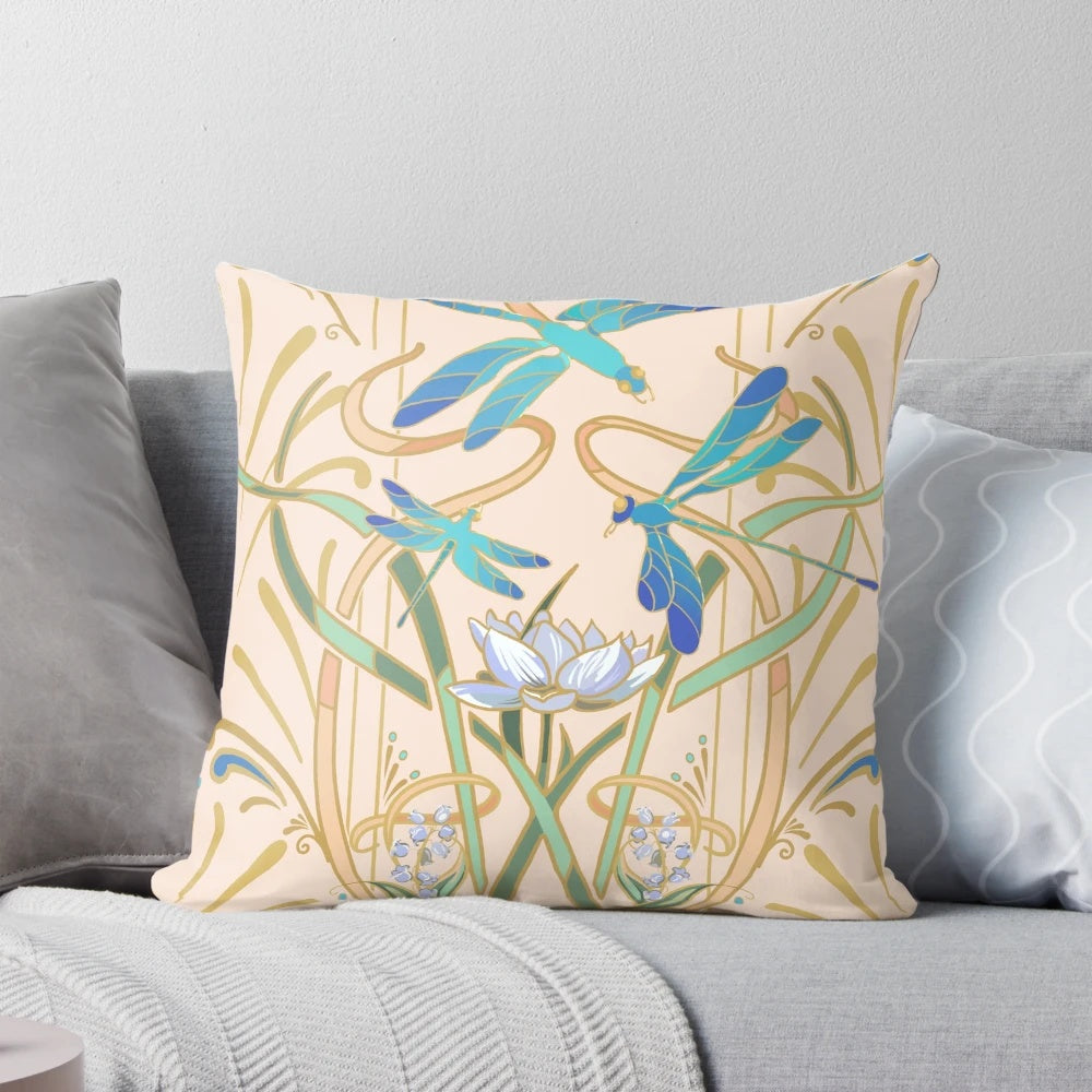 Blush-colored art nouveau style pillow with a repeating dragonfly pattern