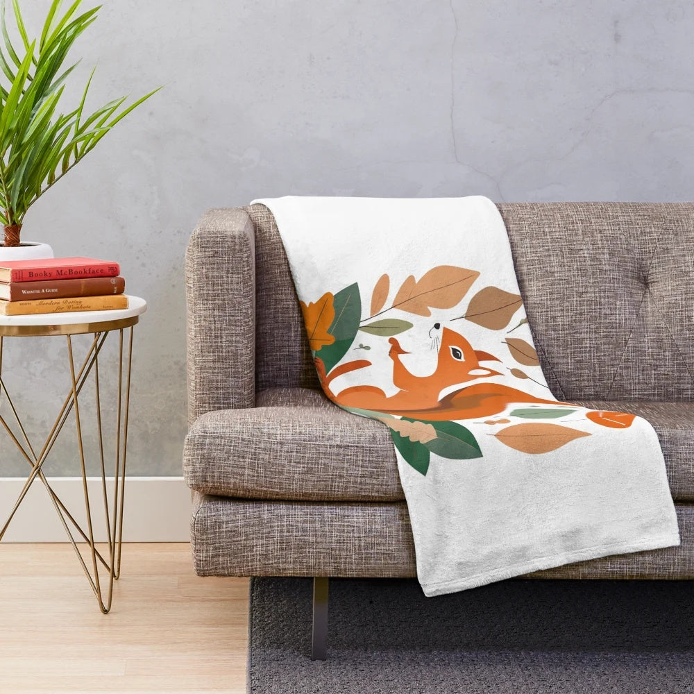 Autumnal wildlife-themed plush blanket with squirrel, leaves, and watercolor art
