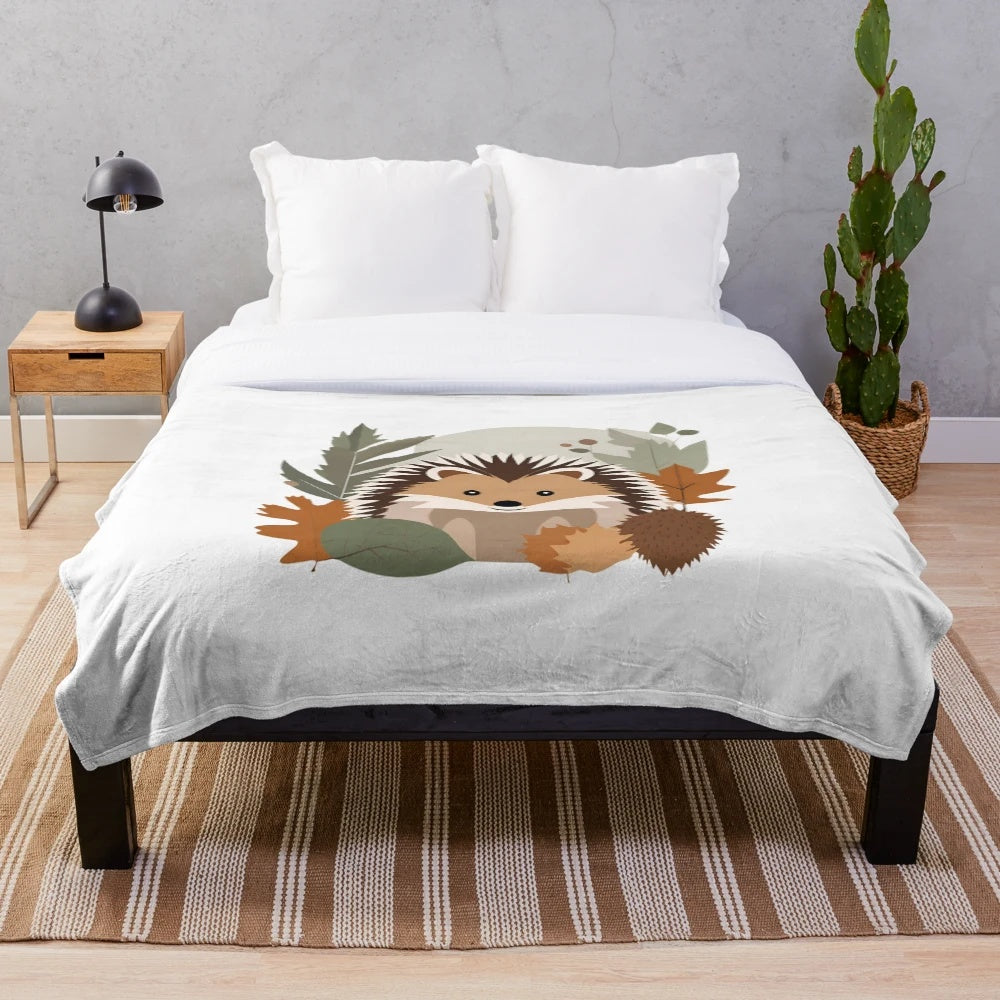 Soft plush blanket featuring a delightful hedgehog design against an autumn leaf background