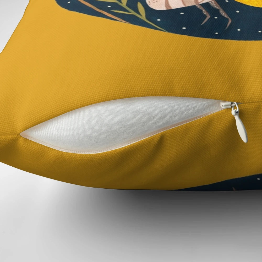 Decorative pillow featuring a golden floral design with buzzing bees