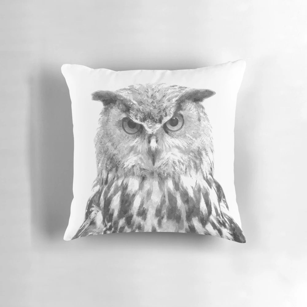 Beautifully rendered black and white owl portrait on a plush decorative pillow
